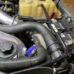 SPE Motorsport 6.7 Powerstroke Coolant Hose Reroute Kit at coolant tank